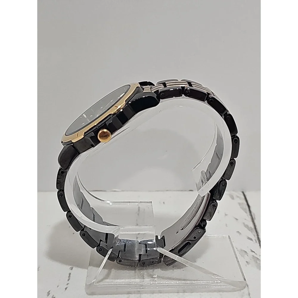 Seiko Quartz 100M watch (black and gold two-tone with day/date)